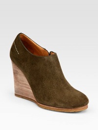 Ultra-soft suede rests on a stacked wedge with an exposed zipper closure. Stacked wedge, 3¾ (95mm)Suede upperSide zipperLeather liningRubber solePadded insoleMade in ItalyOUR FIT MODEL RECOMMENDS ordering one half size up as this style runs small. Ultra-soft suede rests on a stacked wedge with an exposed zipper closure. Stacked wedge, 3¾ (95mm)Suede upperSide zipperLeather liningRubber solePadded insoleMade in ItalyOUR FIT MODEL RECOMMENDS ordering one half size up as this style runs small.