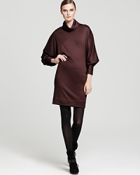 A classic alternative to her celebrated wrap dresses, this DIANE von FURSTENBERG sweater dress is fashioned with stylish Dolman sleeves in a smooth jersey wool. A classic alternative to her celebrated wrap dresses, this DIANE von FURSTENBERG sweater dress is fashioned with stylish Dolman sleeves in a smooth jersey wool.
