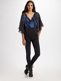 Semi-sheer cowlneck with silk trim, three-quarter flutter sleeves and a retro tie-dye print. Cowlneck Three-quarter flutter sleeves Curved hem Silk trim 93% modal/7% spandex Dry clean Made in USA of imported and American fabricModel shown is 5'10½ (179cm) wearing US size 4. Semi-sheer cowlneck with silk trim, three-quarter flutter sleeves and a retro tie-dye print. Cowlneck Three-quarter flutter sleeves Curved hem Silk trim 93% modal/7% spandex Dry clean Made in USA of imported and American fabricModel shown is 5'10½ (179cm) wearing US size 4.