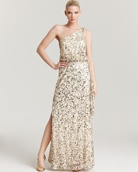 Make a glittering entrance in this sequin-encrusted Aidan Mattox one-shoulder gown, finished with a side slit and tie at the waist. Make a glittering entrance in this sequin-encrusted Aidan Mattox one-shoulder gown, finished with a side slit and tie at the waist.