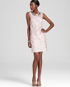 Stunningly sophisticated, Adrianna Papell's sparkling sleeveless dress makes a standout presentation both day and night.