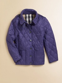 A few trench details distinguish a jacket of classic diamond quilting with a Burberry check lining.Shirt-style collarSnap neck tabShoulder epaulettesSnap placketLong sleevesPatch pocketsDouble back snap ventsCheck liningNylonMachine washImported Please note: Number of snaps may vary depending on size ordered. A few trench details distinguish a jacket of classic diamond quilting with a Burberry check lining.Shirt-style collarSnap neck tabShoulder epaulettesSnap placketLong sleevesPatch pocketsDouble back snap ventsCheck liningNylonMachine washImported Please note: Number of snaps may vary depending on size ordered.