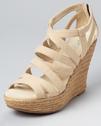 Natural linen feels classic, while a tall espadrille wedge lends warm weather style. Adaptable to any style, these DKNY sandals can go the route of classic-chic or boho-glam. Natural linen feels classic, while a tall espadrille wedge lends warm weather style. Adaptable to any style, these DKNY sandals can go the route of classic-chic or boho-glam.