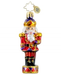A classic nutcracker makes a grand statement upon your tree as he stands tall and proud in this hand-painted ornament from Christopher Radko. A classic nutcracker makes a grand statement upon your tree as he stands tall and proud in this hand-painted ornament from Christopher Radko.
