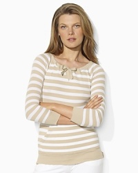 A chic complement to an active lifestyle, this waffle-knit essential gets the sporty treatment with sleek stripes, herringbone drawstrings and a kangaroo pocket. A chic complement to an active lifestyle, this waffle-knit essential gets the sporty treatment with sleek stripes, herringbone drawstrings and a kangaroo pocket.