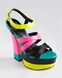 In electric neon hues, DV8 Dolce Vita's Jubilee sandals tower in a 6 heel. In electric neon hues, DV8 Dolce Vita's Jubilee sandals tower in a 6 heel.