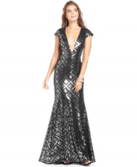 Have a flair for the dramatic? BCBGMAXAZRIA's deco-inspired sequined gown was made for you--cap sleeves and a daring V-neckline are electrifying touches. Have a flair for the dramatic? BCBGMAXAZRIA's deco-inspired sequined gown was made for you--cap sleeves and a daring V-neckline are electrifying touches.