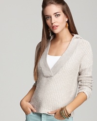 James Perse elevates the basic hoodie with a sultry deep V neck and trend-perfect waffle knit. James Perse elevates the basic hoodie with a sultry deep V neck and trend-perfect waffle knit.