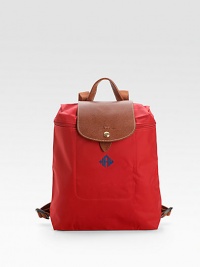 Both sporty and timeless, this foldable, packable backpack version of the signature pliage design combines the lightweight ease of nylon with the richness of leather trim.Webbed backpack straps adjust from about 10-36 Leather handle Top zipper and snap flap closures Inside pocket Fully lined Nylon canvas; leather trim 10¼W X 12¼H X 4D ImportedFOR PERSONALIZATIONSelect a color and quantity Both sporty and timeless, this foldable, packable backpack version of the signature pliage design combines the lightweight ease of nylon with the richness of leather trim.Webbed backpack straps adjust from about 10-36 Leather handle Top zipper and snap flap closures Inside pocket Fully lined Nylon canvas; leather trim 10¼W X 12¼H X 4D ImportedFOR PERSONALIZATIONSelect a color and quantity