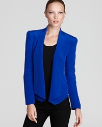 A sharp asymmetric hemline is eye-catching on this Rebecca Minkoff silk blazer, replete with puff shoulders and pleating at the elbows. In line with the season's color trend, the vivid look updates the LBD from subtle to sublime.