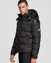 A glossy hood contrasts with the matte shell for a striking designer touch on this brilliant winter coat from Moncler, insulated with down for major warmth and constructed for ease of movement. A glossy hood contrasts with the matte shell for a striking designer touch on this brilliant winter coat from Moncler, insulated with down for major warmth and constructed for ease of movement.