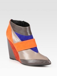 Colorblock suede and leather wedge silhouette, finished with an exposed side zipper. Suede and leather wedge, 4 (100mm)Suede and leather upperSide zipperLeather lining and solePadded insoleMade in Italy Colorblock suede and leather wedge silhouette, finished with an exposed side zipper. Suede and leather wedge, 4 (100mm)Suede and leather upperSide zipperLeather lining and solePadded insoleMade in Italy