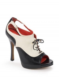 THE LOOKColorblocked leather upperOxford-inspired designLace-up closurePeep-toeCutout elastic and buckle details at sidesPadded insoleSelf-covered heel, 4½(115mm)Self-covered platform, ½(15mm)Compares to a 4 heel(100mm)THE MATERIALLeather upperLeather lining and soleORIGINImported THE LOOKColorblocked leather upperOxford-inspired designLace-up closurePeep-toeCutout elastic and buckle details at sidesPadded insoleSelf-covered heel, 4½(115mm)Self-covered platform, ½(15mm)Compares to a 4 heel(100mm)THE MATERIALLeather upperLeather lining and soleORIGINImported