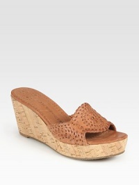 Earthy cork wedge and platform graced by a supple leather upper with embroidery-like stitching. Cork wedge, 2½ (65mm)Cork platform, 1 (25mm)Compares to a 1½ heel (40mm)Leather upperLeather liningRubber solePadded insoleImportedOUR FIT MODEL RECOMMENDS ordering true size. Earthy cork wedge and platform graced by a supple leather upper with embroidery-like stitching. Cork wedge, 2½ (65mm)Cork platform, 1 (25mm)Compares to a 1½ heel (40mm)Leather upperLeather liningRubber solePadded insoleImportedOUR FIT MODEL RECOMMENDS ordering true size.