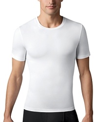Gentlemen, expect more from your undershirt! This cotton compression crew tee will forever change the way you look and feel in your clothes. Made with high-quality, ring-spun cotton, this tee leaves no bulk under clothes. Gentlemen, expect more from your undershirt! This cotton compression crew tee will forever change the way you look and feel in your clothes. Made with high-quality, ring-spun cotton, this tee leaves no bulk under clothes.