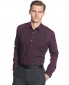 Slim fitting shirt by Calvin Klein with micro vertical stripes is handsomely chic.