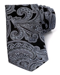 Paisley flourishes across this silk tie for a look that's boldly classic. Paisley flourishes across this silk tie for a look that's boldly classic.