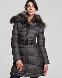 An oversized, adjustable fur collar brings statement luxe to this quilted Dawn Levy puffer coat. An oversized, adjustable fur collar brings statement luxe to this quilted Dawn Levy puffer coat.