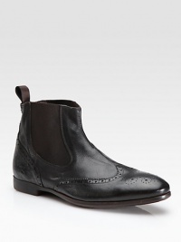 Classic wingtip perforations on supple leather with stretch side gores.Pull tab Leather lining Rubber sole Imported Classic wingtip perforations on supple leather with stretch side gores.Pull tab Leather lining Rubber sole Imported