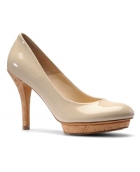 The Isola Danchen Pumps add a new twist to the modern classic platform pump with their lustrous patent upper and fresh cork-covered recessed platform and heel. The Isola Danchen Pumps add a new twist to the modern classic platform pump with their lustrous patent upper and fresh cork-covered recessed platform and heel.