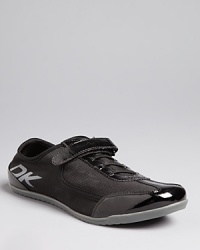 Athletic meets fashion in these DKNY sneakers. Slip them on-stretch laces-with polished patent details, they will get you to work or through your daily errands in record speed and style. Athletic meets fashion in these DKNY sneakers. Slip them on-stretch laces-with polished patent details, they will get you to work or through your daily errands in record speed and style.