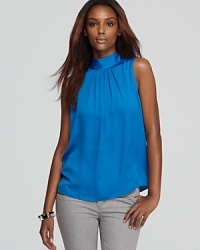 An impeccable style choice for your 9-to-5 and beyond, this AK Anne Klein blouse flaunts a chic mock neckline and pleated trapeze silhouette for a stunning silhouette. An impeccable style choice for your 9-to-5 and beyond, this AK Anne Klein blouse flaunts a chic mock neckline and pleated trapeze silhouette for a stunning silhouette.