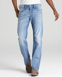 A straight jean with a very light blue rinse and contrast sandblast fading and bleaching along the leg and seat. A straight jean with a very light blue rinse and contrast sandblast fading and bleaching along the leg and seat.