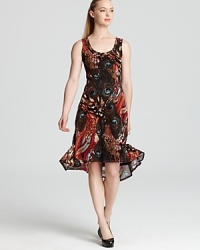 A rush of exotic print, this Karen Kane dress infuses your summer style with untamed femininity. Play up the fluttering hemline with polished pumps. A rush of exotic print, this Karen Kane dress infuses your summer style with untamed femininity. Play up the fluttering hemline with polished pumps.