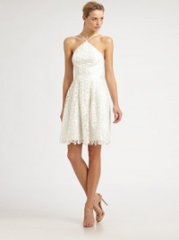 The sweetest embroidered lace, tailored with a crisp, architectural neckline and a beautifully scalloped hem.Halter-style neckline with spaghetti strapsBanded waistGathered skirtScalloped hemlineConcealed back zipFully linedAbout 21 from natural waistPolyesterDry cleanImportedModel shown is 5'10 (177cm) wearing US size 4. The sweetest embroidered lace, tailored with a crisp, architectural neckline and a beautifully scalloped hem.Halter-style neckline with spaghetti strapsBanded waistGathered skirtScalloped hemlineConcealed back zipFully linedAbout 21 from natural waistPolyesterDry cleanImportedModel shown is 5'10 (177cm) wearing US size 4.