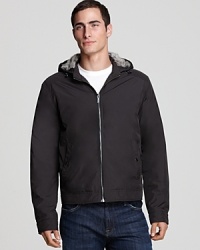 What at first appears to be a handsome, straightforward jacket reveals itself as modern luxury with a soft fur lined hood, the perfect shake-it-up element that shows off your superlative aesthetic. What at first appears to be a handsome, straightforward jacket reveals itself as modern luxury with a soft fur lined hood, the perfect shake-it-up element that shows off your superlative aesthetic.