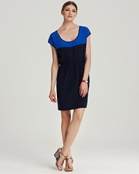 Every city girl needs a statement dress that goes from day to night. A flattering black silhouette meets a pop of cobalt color blocking for timeless elegance. Every city girl needs a statement dress that goes from day to night. A flattering black silhouette meets a pop of cobalt color blocking for timeless elegance.