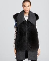 Luxe fur adorns this plush wool Vera Wang vest with oversized collar. Luxe fur adorns this plush wool Vera Wang vest with oversized collar.