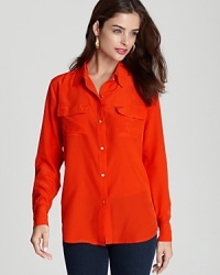 Master utilitarian chic in this Juicy Couture silk blouse, outfitted in a commanding shade of red for serious fashion presence. Master utilitarian chic in this Juicy Couture silk blouse, outfitted in a commanding shade of red for serious fashion presence.