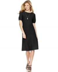 A carefree silhouette in a bold, springtime color makes this J Jones New York dress an everyday essential. A carefree silhouette in a bold, springtime color makes this J Jones New York dress an everyday essential.
