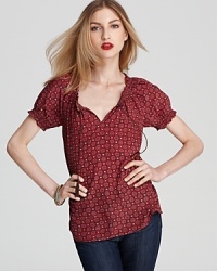 An au courant take on bohemian style, this Joie top boasts smocking details and a vintage-inspired print. An au courant take on bohemian style, this Joie top boasts smocking details and a vintage-inspired print.