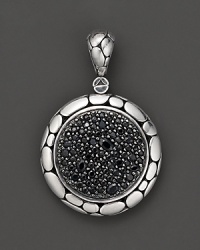 From the Kali collection, a medium round enhancer with featuring black sapphires and framed in sterling silver,designed by John Hardy. From the Kali collection, a medium round enhancer with featuring black sapphires and framed in sterling silver,designed by John Hardy.