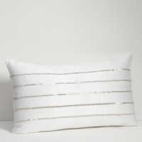 Embroidered and embellished decorative pillows complement the bedding ensemble. Embroidered and embellished decorative pillows complement the bedding ensemble.