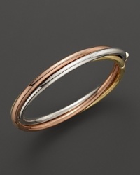 A classic bangle in 18K yellow, rose and white golds. From Roberto Coin.