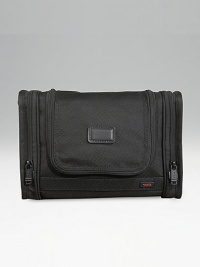 A versatile travel kit for toiletries and cosmetics that hangs from virtually any fixture, and also works on countertops. Inside mesh, zip and elastic pockets Exterior end pockets Hanging hook and carry handle Zip around entry Tumi Tracer Protection Ballistic nylon Imported 8H X 11¾W X 3D A versatile travel kit for toiletries and cosmetics that hangs from virtually any fixture, and also works on countertops. Inside mesh, zip and elastic pockets Exterior end pockets Hanging hook and carry handle Zip around entry Tumi Tracer Protection Ballistic nylon Imported 8H X 11¾W X 3D