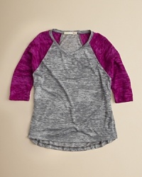 A classic baseball tee is updated in soft slub and striking contrast colorblocks, finished with a chic rounded high/low hem. A classic baseball tee is updated in soft slub and striking contrast colorblocks, finished with a chic rounded high/low hem.