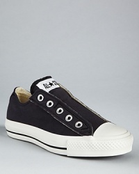 Faux lace-up converse for those who can't be bothered with tying their shoes. Just slip-on and walk out in style. A low-top canvas sneaker with rubber sole.