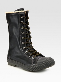 The best way to beat the cold is in high style. Complete your stylish cold-weather ensemble with this tall lace-up boot, constructed from leather with a sturdy rubber sole and a wool lining for long-lasting warmth and comfort.LeatherPadded insoleRubber soleImported The best way to beat the cold is in high style. Complete your stylish cold-weather ensemble with this tall lace-up boot, constructed from leather with a sturdy rubber sole and a wool lining for long-lasting warmth and comfort.LeatherPadded insoleRubber soleImported