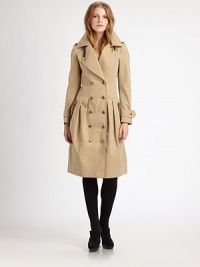 This heritage cotton gabardine trench is elevated by luxe leather details.Notched lapelsEpaulettesLeather throat latchDouble-breasted button frontButton cuff tabsSelf beltPleated skirtSide button pocketsButton rainflapFully linedAbout 30 from shoulder to hemCottonDry cleanImportedModel shown is 5'10 (177cm) wearing US size 2. This heritage cotton gabardine trench is elevated by luxe leather details.Notched lapelsEpaulettesLeather throat latchDouble-breasted button frontButton cuff tabsSelf beltPleated skirtSide button pocketsButton rainflapFully linedAbout 30 from shoulder to hemCottonDry cleanImportedModel shown is 5'10 (177cm) wearing US size 2.
