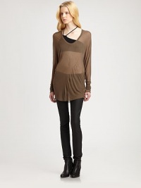 From the HELMUT capsule collection. Semi-sheer modal v-neck complemented by dropped shoulders and an ultra-long silhouette. Rounded v-neckDropped shouldersLong sleevesLonger length hits below the hipsModalDry cleanImportedModel shown is 5'10 (177cm) wearing US size Small. From the HELMUT capsule collection. Semi-sheer modal v-neck complemented by dropped shoulders and an ultra-long silhouette. Rounded v-neckDropped shouldersLong sleevesLonger length hits below the hipsModalDry cleanImportedModel shown is 5'10 (177cm) wearing US size Small.