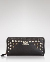Tough meets on-the-go-chic in this Juicy Couture leather wallet, which works a hard-hitting vibe with studded detailing. Tough meets on-the-go-chic in this Juicy Couture leather wallet, which works a hard-hitting vibe with studded detailing.