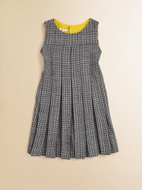 A retro, school-girl design in houndstooth goes modern with colorful piping at the neckline. Houndstooth patternRound neckline with contrast pipingSleevelessPleated bodice and skirtFit and flare silhouetteBack button closure50% fleece wool/50% viscoseMachine washMade in Italy A retro, school-girl design in houndstooth goes modern with colorful piping at the neckline. Houndstooth patternRound neckline with contrast pipingSleevelessPleated bodice and skirtFit and flare silhouetteBack button closure50% fleece wool/50% viscoseMachine washMade in Italy