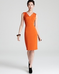 Add color to your closet with this boldly-hued Escada dress with sunburst seaming detail and a structured silhouette. Add color to your closet with this boldly-hued Escada dress with sunburst seaming detail and a structured silhouette.