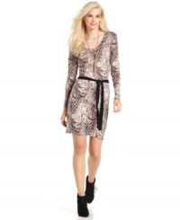 Wild one: Calvin Klein Jeans' body-hugging sweater dress features a bold snakeskin print for an on-trend touch. Wild one: Calvin Klein Jeans' body-hugging sweater dress features a bold snakeskin print for an on-trend touch.