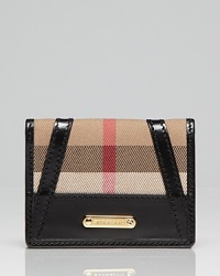 Less is more: Burberry's sized-right card case is a practical piece with major fashion credentials. Less is more: Burberry's sized-right card case is a practical piece with major fashion credentials.