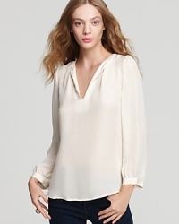 A pure silk blouse with a relaxed V neckline for top-level chic. A pure silk blouse with a relaxed V neckline for top-level chic.